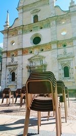 View of empty chairs against building