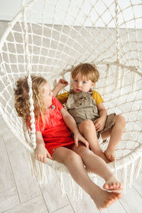 Children swinging on a swing