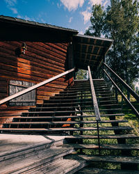 Low angle view of staircase by building against sky