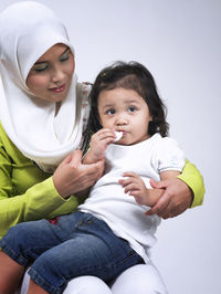 Portrait of happy mother and baby