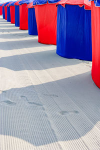 Multi colored umbrella on footpath