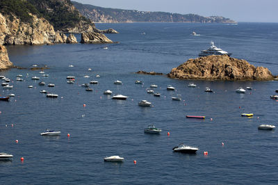 Boats moored in sea