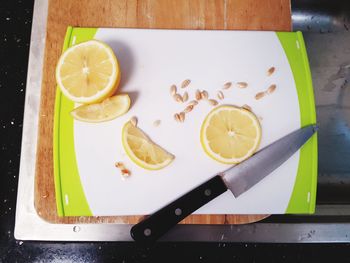 Lemon slided with a knife and chopping board