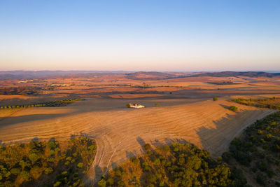 High angle view of land against sky during sunset