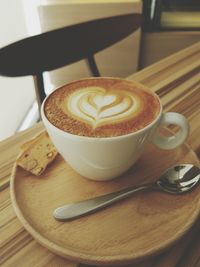 Close-up of cappuccino on table