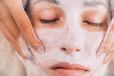 Close-up of woman getting massage therapy at spa