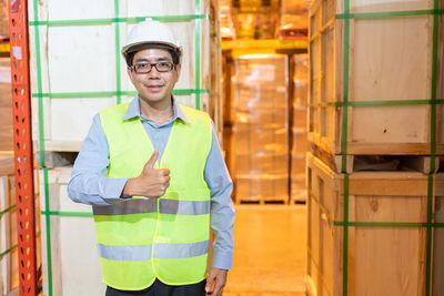 Portrait of smiling man standing in office