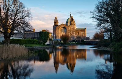 Morning scenery with galway cathedral reflected in corrib river in ireland