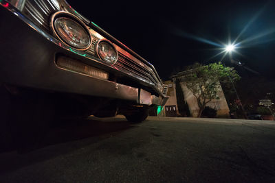 Illuminated car against sky at night