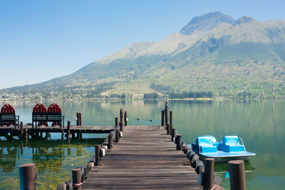 Jetty in lake against mountain