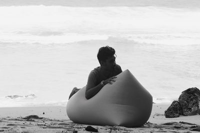 Man sitting at beach 