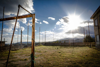 Scenic view of field against sky on sunny day