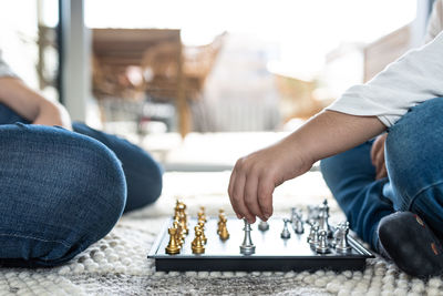 Close up of hands playing chess