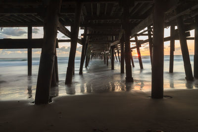 Low angle view of bridge at calm sea