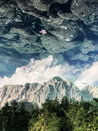 Scenic view of mountains reflecting on calm lake