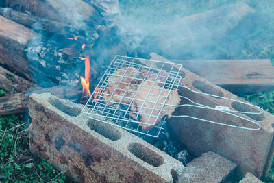 High angle view of meat on barbecue grill