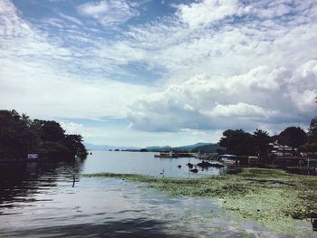 Scenic view of sea against cloudy sky