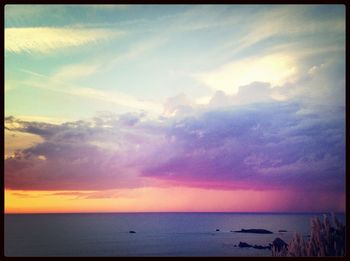 Scenic view of sea against cloudy sky