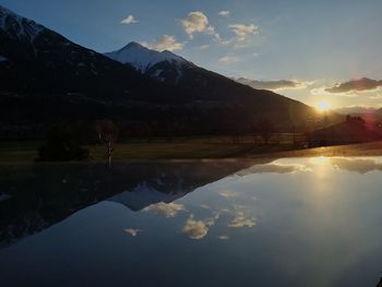 Scenic view of lake against sky during sunset