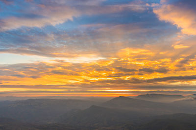 Scenic view of landscape against sky during sunset