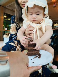 Low angle view of girl holding ice cream