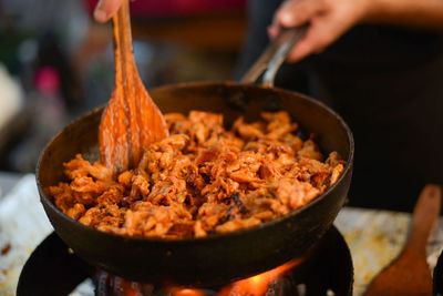 Close-up of person preparing food