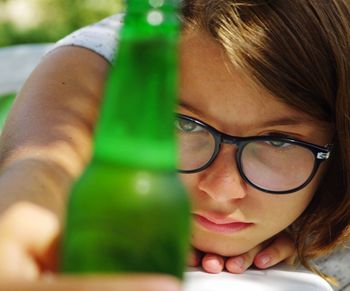 Close-up of girl holding bottle