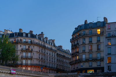 Low angle view of buildings against clear sky