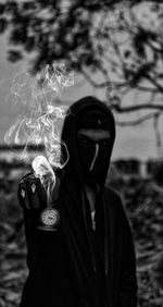 Midsection of man holding plant