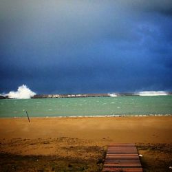 Scenic view of sea against cloudy sky