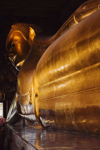 Low section of man standing in water
