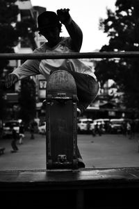 Rear view of statue on street in city