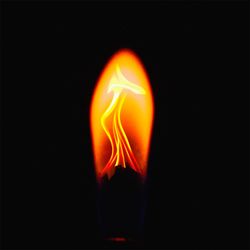 Close-up of lit candle