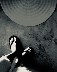 Low section of woman resting on floor