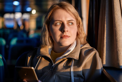 Portrait of woman looking at camera