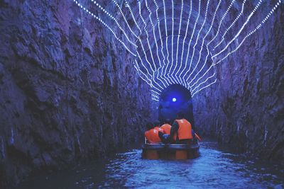 Rear view of man swimming in sea