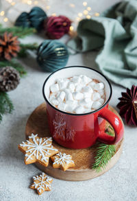 Cozy winter and christmas setting with hot cocoa and homemade cookies