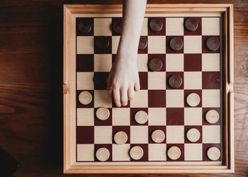 High angle view of man playing on table