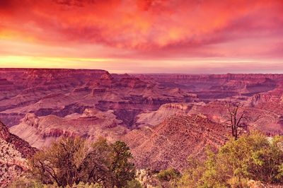 Scenic view of landscape against dramatic sky