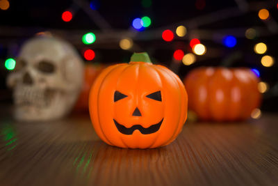 Illuminated pumpkin on table during halloween