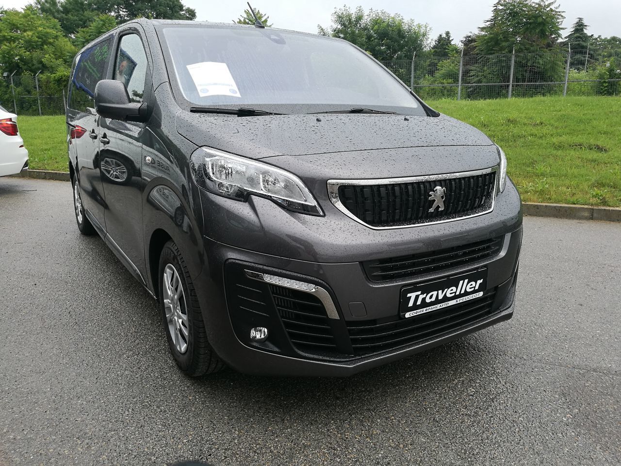 CLOSE-UP OF CAR PARKED ON ROAD