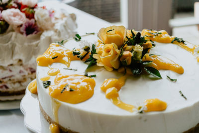 Delicious wedding cake with colorful flowers