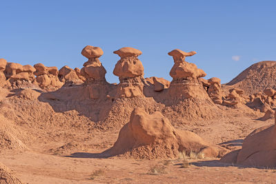 Hoodoos in a red rock country valley in goblin valley state park in utah