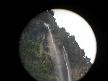 Scenic view of tree seen through hole