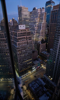 High angle view of street amidst buildings in city