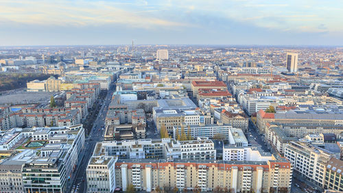 Aerial view of cityscape against sky