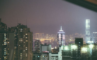 View of skyscrapers lit up at night