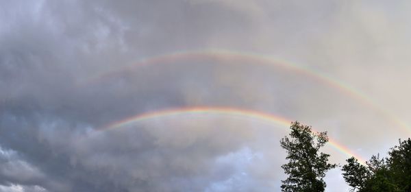 Low angle view of rainbow against sky