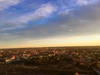 High angle shot of townscape against sky at sunset