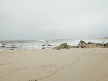 Scenic view of beach and sea against sky